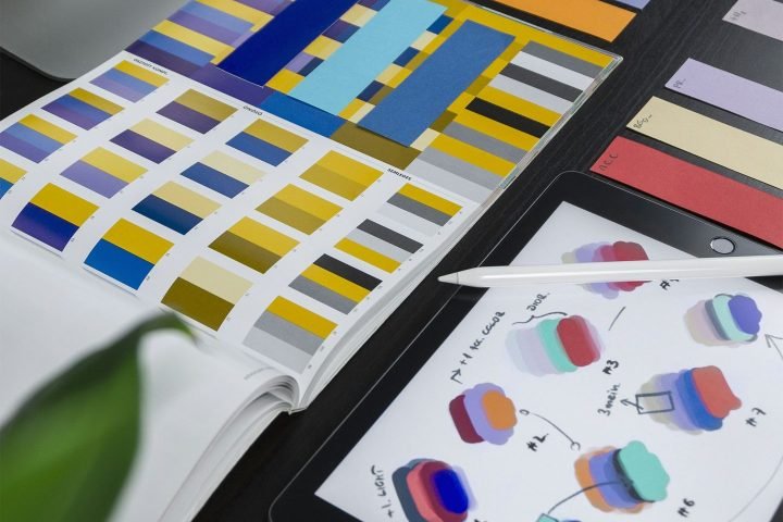 Colour swatches and printed design samples on a table