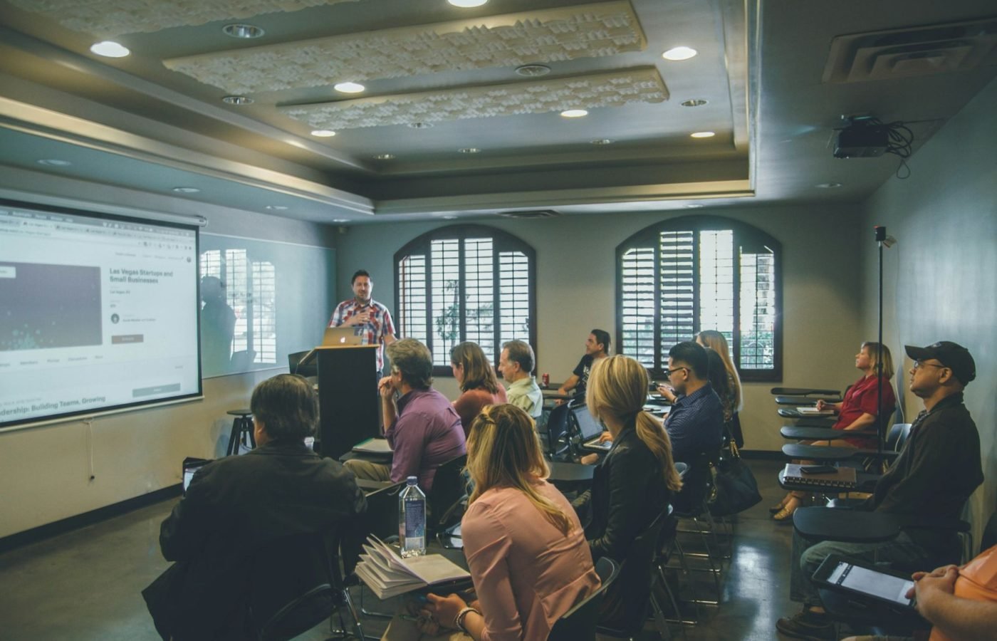 Staff attending a training session in a seminar room