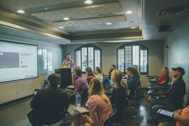 Staff attending a training session in a seminar room