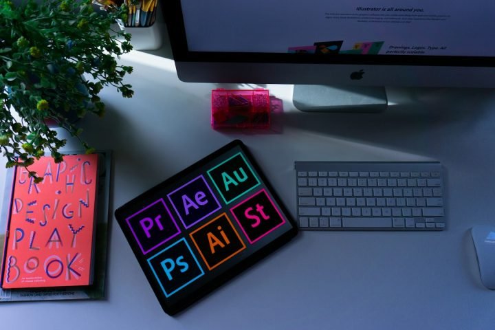 Design desk with a tablet, notebook and computer